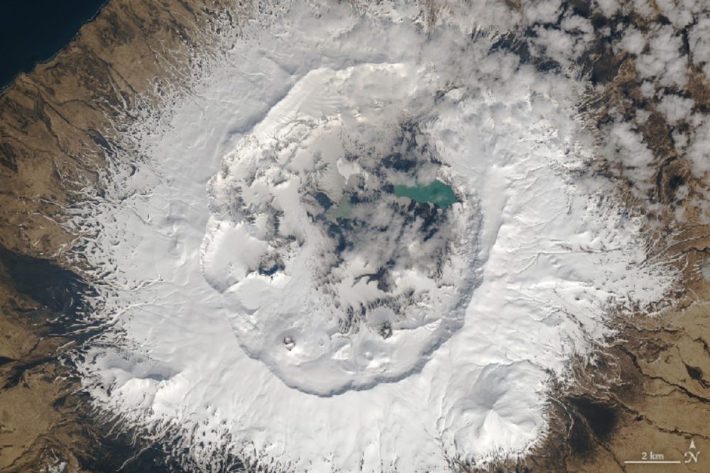 Umnak Island. Landsat caught a rare glimpse of the third-largest Aleutian Island. Image Credit: NASA Earth Observatory images by Joshua Stevens, using Landsat data from the U.S. Geological Survey.