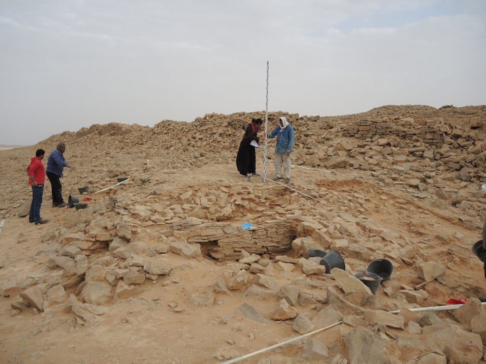 An image of the stone platform during excavation. Image Credit: MADAJ.