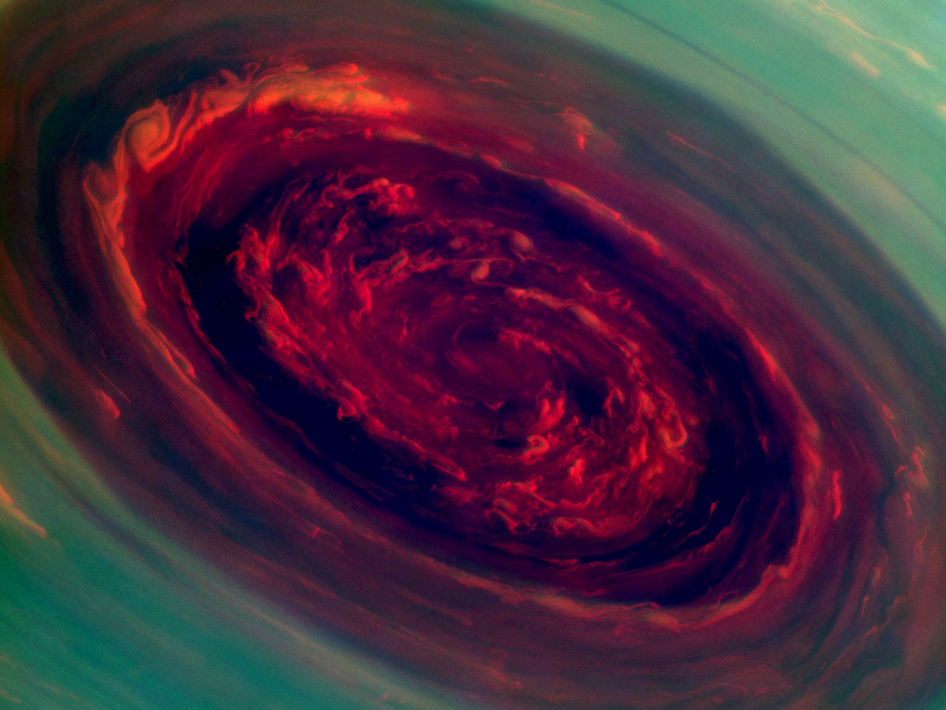 False-color image from the Cassini probe of the central vortex deep inside the hexagon formation. Image Credit: NASA.