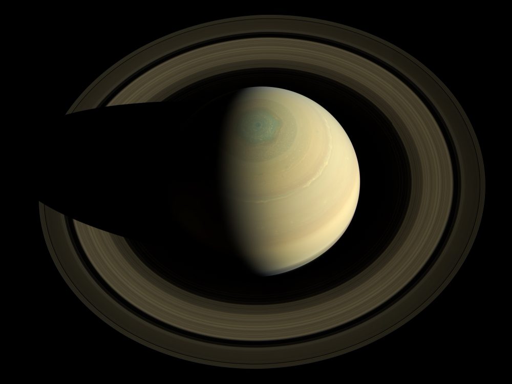 A view of Saturn, its rings and its curious hexagon. Jumpstory.
