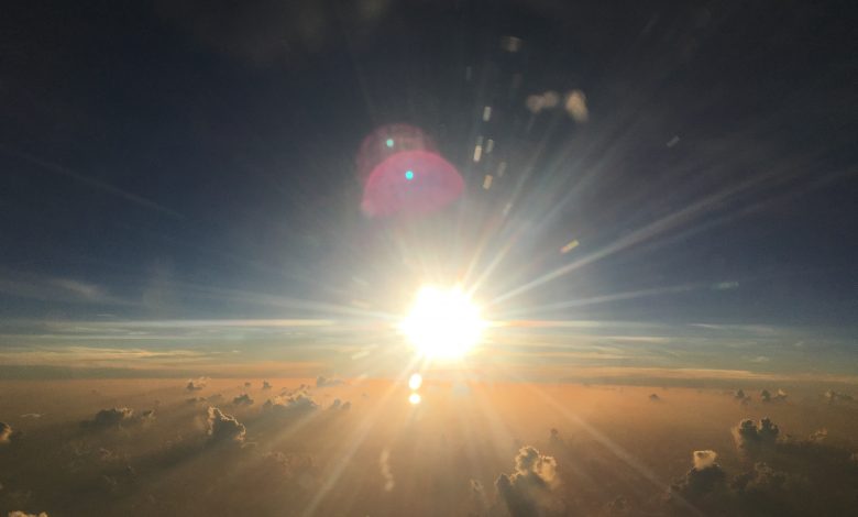 The sun just above the horizon. Jumpstory.