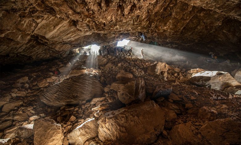 An image showing scientists exploring the Chiquihuite Cave, located in a mountainous area in northern Mexico. Image Credit: Devlin A. Gandy.