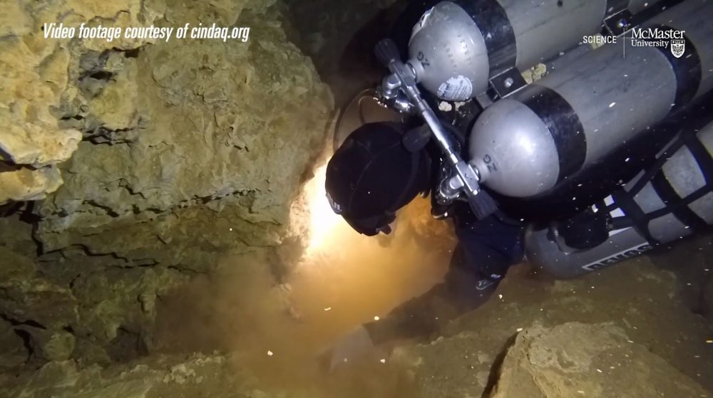 A screenshot showing a diver exploring the now sunken ochre mine in Quintana Roo, Mexico. Image Credit: McMaster University / Vimeo.