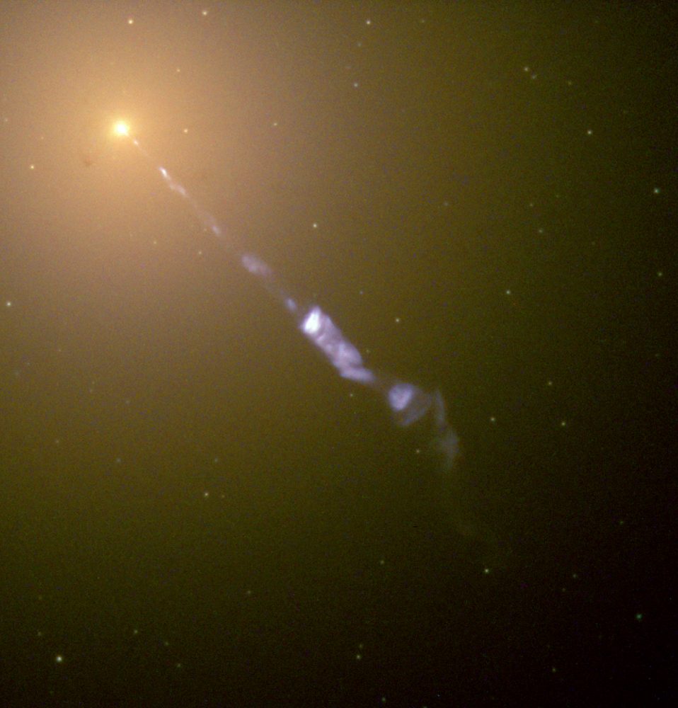 The jet of matter is ejected from M87 at nearly the speed of light, and stretches 1.5 kpc (5 kly) from the galactic core. Image Credit: Hubble / Wikimedia Commons.