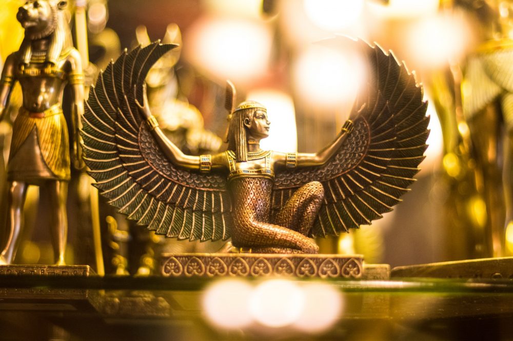 An image showing a statuette of the ancient Egyptian goddess Isis. Unsplash.