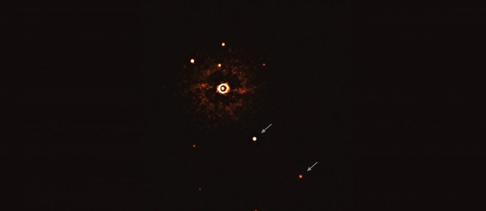 This image, captured by the SPHERE instrument on ESO’s Very Large Telescope, shows the star TYC 8998-760-1 accompanied by two giant exoplanets. Image Credit: ESO/Bohn et al.