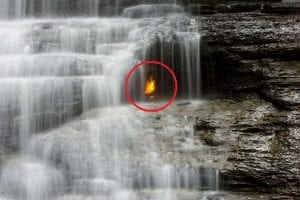 A close-up of the gas-lit flame below Eternal Flame Falls in Chestnut Ridge Park, Orchard Park, NY. Image Credit: Wikimedia Commons.