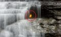 A close-up of the gas-lit flame below Eternal Flame Falls in Chestnut Ridge Park, Orchard Park, NY. Image Credit: Wikimedia Commons.