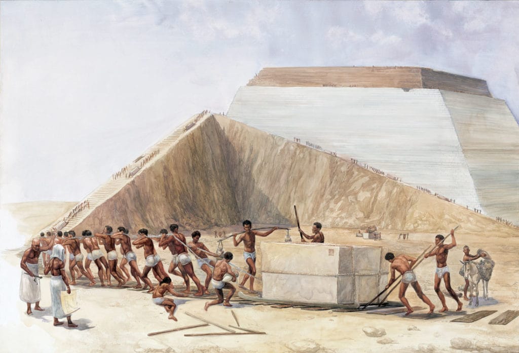 An artist's illustration showing the builders of the pyramids hauling massive blocks of stone up a ramp.