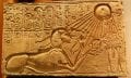An ancient Egyptian illustration showing the worship of the sun disk Aten.