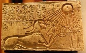 An ancient Egyptian illustration showing the worship of the sun disk Aten.