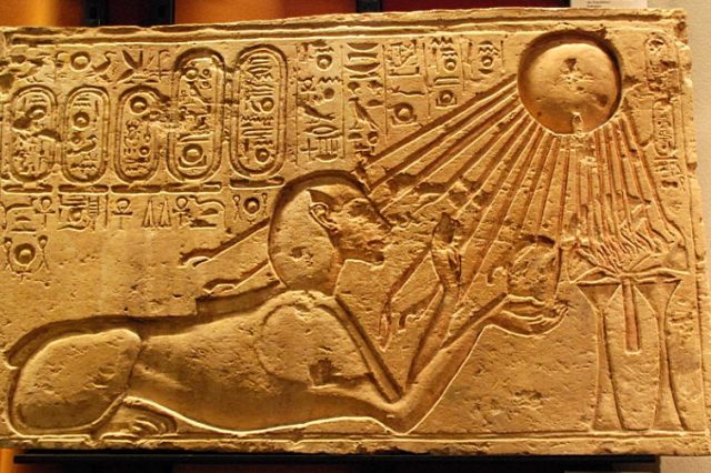 An ancient Egyptian illustration showing the worship of the sun disk Aten.