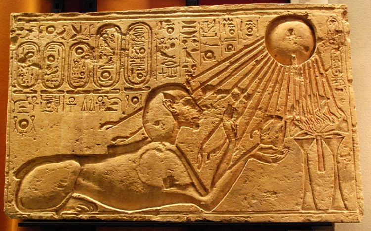 An ancient Egyptian illustration showing the worship of the sun disk Aten.