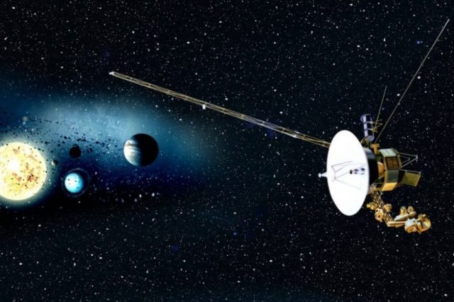 An artists rendering of the Voyager mission and the sun and planets in the background.