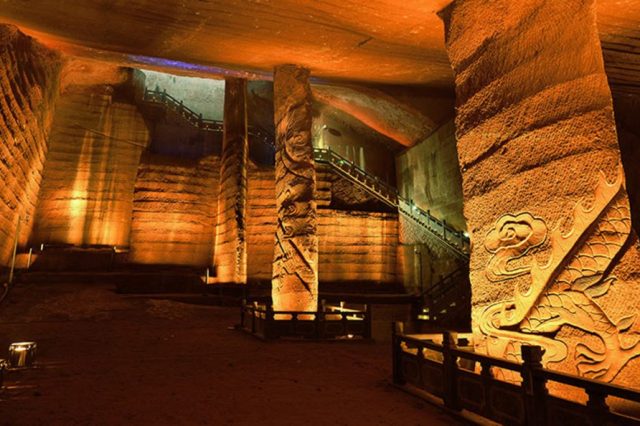 One of the largest caverns in the Longyou caves complex. You can see the mysterious wall decorations and grand pillars that have remained intact after thousands of years under water.