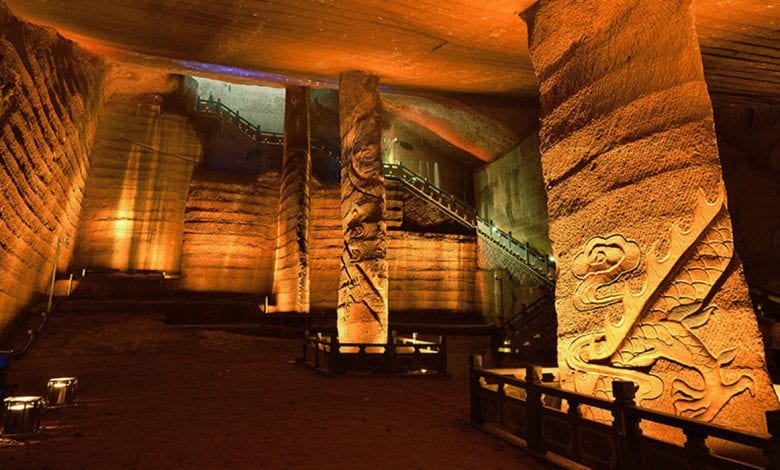 One of the largest caverns in the Longyou caves complex. You can see the mysterious wall decorations and grand pillars that have remained intact after thousands of years under water.