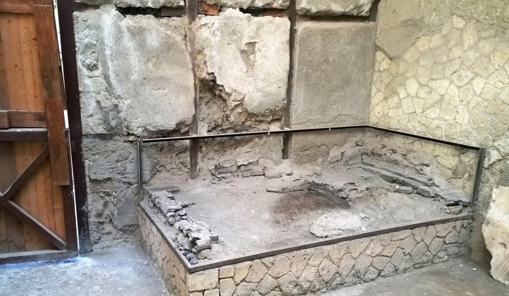 Remains of the wooden bed at which the victim of the eruption was found originally. 