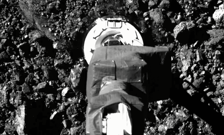 SamCam view of the sampling event on asteroid Bennu. Image Credit: NASA.