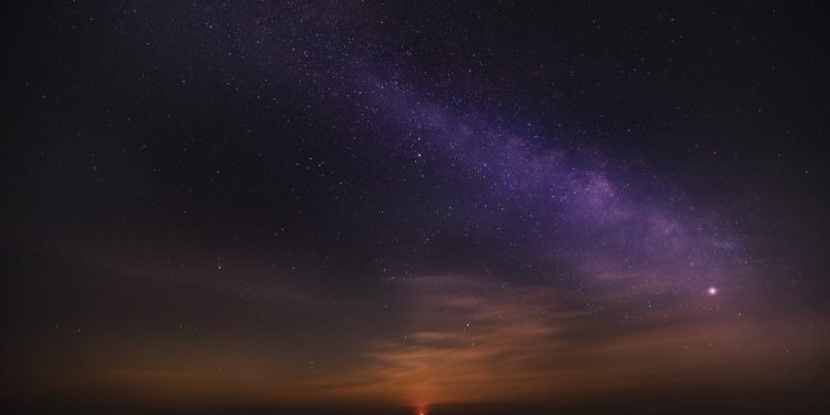 An image of sunrise and the stars in the sky. Jumpstory.