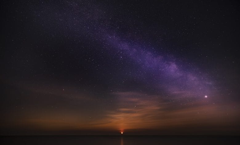 An image of sunrise and the stars in the sky. Jumpstory.