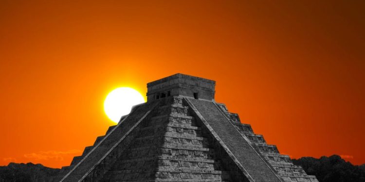 The sun rising behind the step pyramid in Chichen Itza, one of the many ancient monuments around the world built to align with the sun on the days of the solstices.