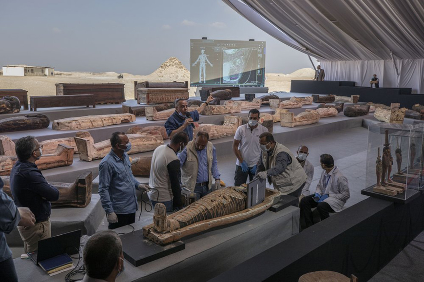 The exhibition of the latest discovery of ancient Egyptian sarcophagi and statuettes. Here, you can see the moment of the X-Ray scan performed in front of the guests. Credit: Associated Press