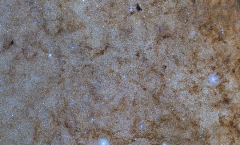 The central bulge of the Milky Way presented in a color-composite image. Credit: Noirlab.edu