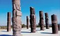 The massive statues of the Toltec Warriors holding the curious Handbags of the Gods. Where else has this motif been found? Credit: Britannica