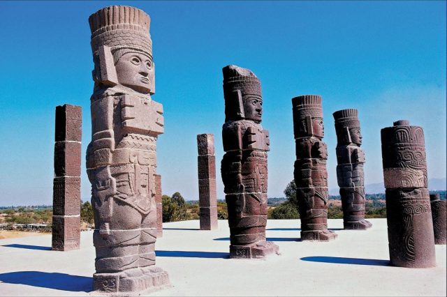The massive statues of the Toltec Warriors holding the curious Handbags of the Gods. Where else has this motif been found? Credit: Britannica