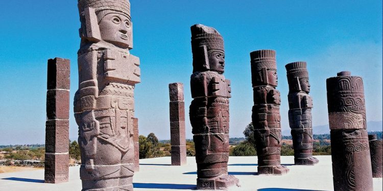 The massive statues of the Toltec Warriors holding the curious Handbags of the Gods. Where else has this motif been found? Credit: Britannica