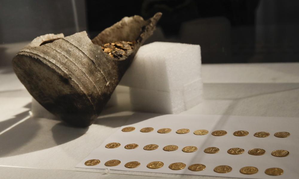 27 of the Roman coins were put on display during the reveal of the discovery. Credit: Italian Ministry of Culture