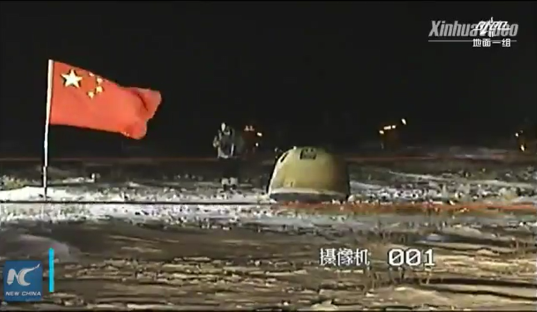 The Chang'e 5 return capsule photographed at the landing site. Credit: New China