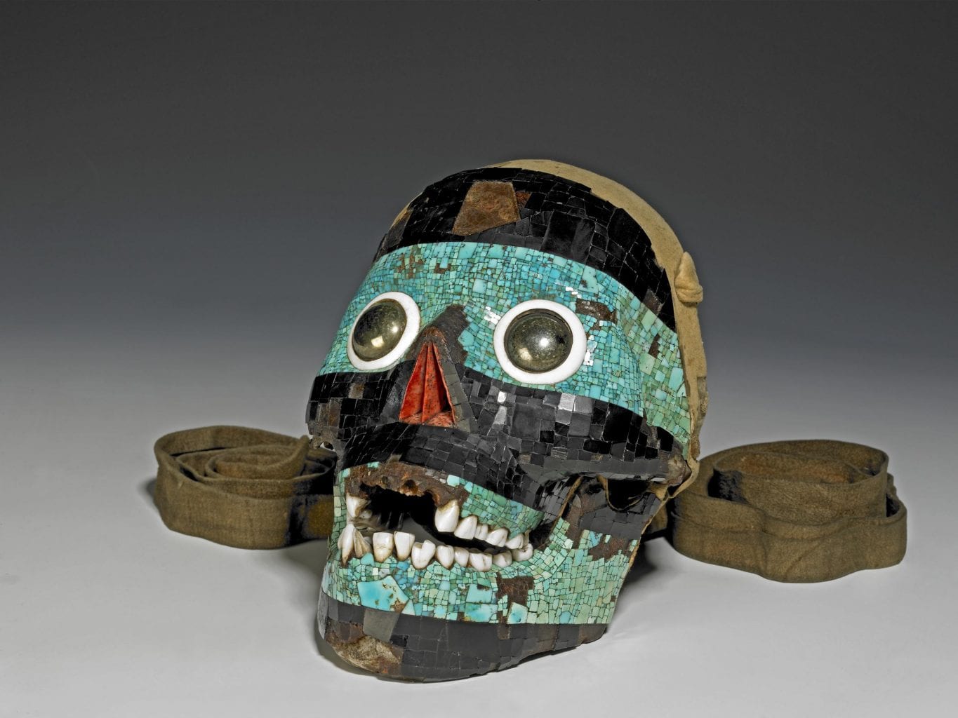 Experts believe this decorated human skull is a depiction of the Mesoamerican deity Tezcatlipoca. Credit: British Museum