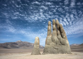 The massive sculpture in the middle of the Chilean desert respectively called the Hand of the Desert. Credit: DepositPhotos