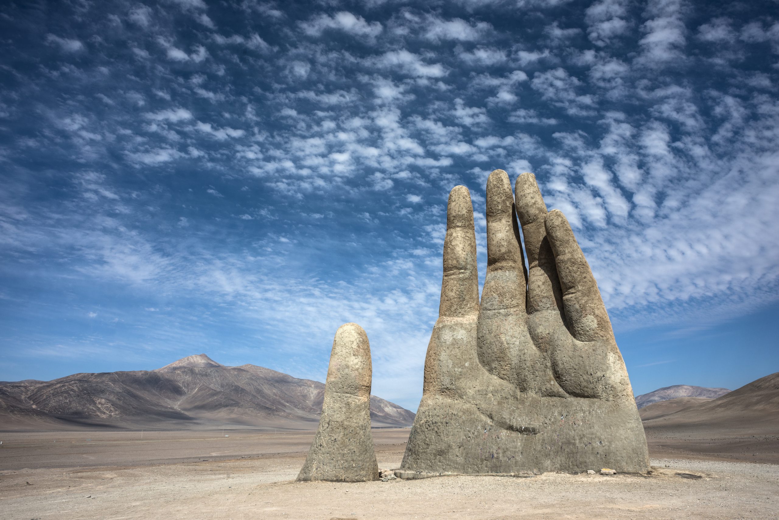 The massive sculpture in the middle of the Chilean desert respectively called the Hand of the Desert. Credit: DepositPhotos