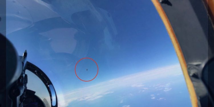 This image, snapped by a US Navy Pilot, shows the UFO circled in red. Image Credit: The Debrief.