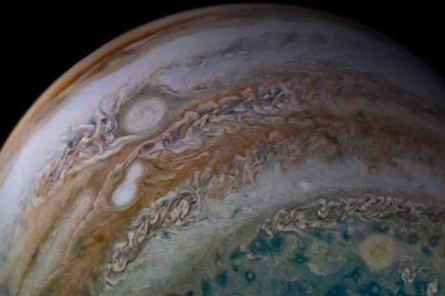 Two massive stones caught merging together on Jupiter by the Juno Spacecraft. Credit: NASA/Juno Image Gallery
