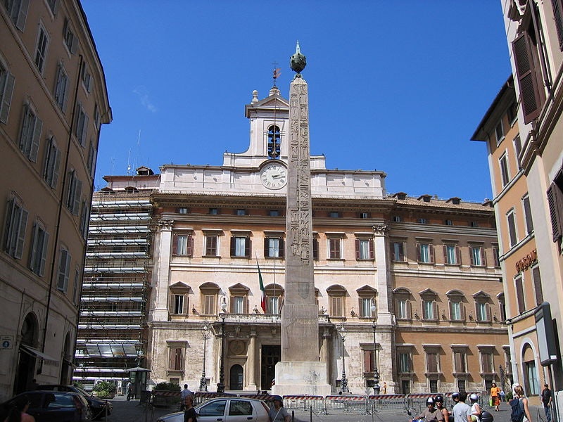 The Egyptian Obelisk of Montecitorio today stands on the gnomom of the original Horologium Augusti. Remains of the original platform that once spanned 160 × 75 meters can be accessed through the building in the back if you request access in advance. This was the most grandeur Roman sundial used to tell time with high accuracy. Credit: 500 Hidden Secrets
