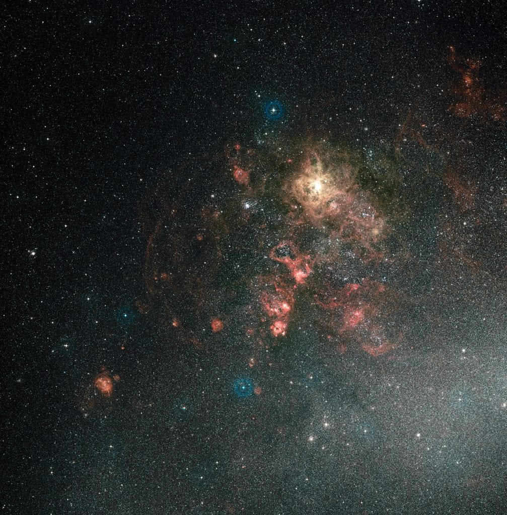 A ground-based view of the Tarantula Nebula, the largest such object in the universe. Credit: NASA, ESA, Digitized Sky Survey 2. Acknowledgement: Davide De Martin