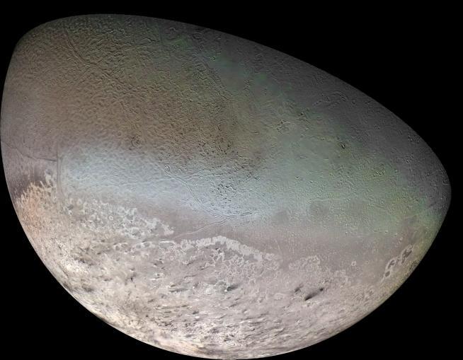 Color mosaic of Triton made from footage of Voyager 2. Credit: NASA/JPL/USGS