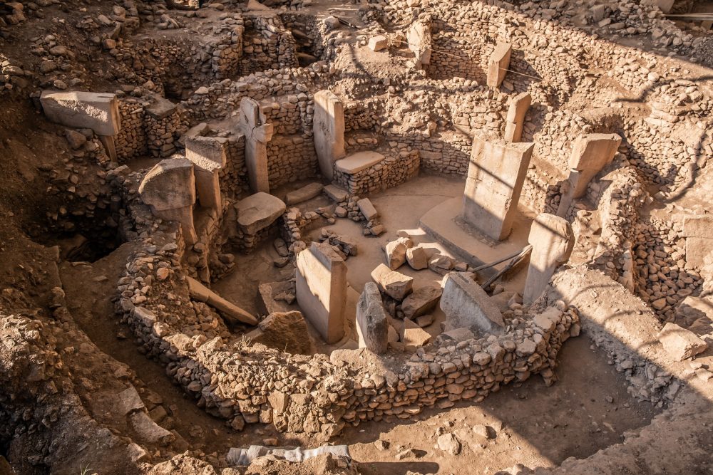 Why the origins of civilization might lie in a forgotten Turkish hill. High-quality shot of the beautiful megalithic circle at the center of Gobekli Tepe, filled with pillars. Credit: Shutterstock