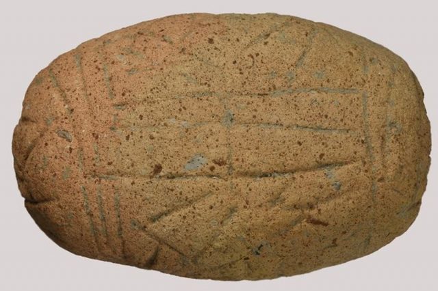 Here is the newly found clay tablet in Bulgaria. It is about 7000 years old and has been carved in a mystery language. Credit: National Institute and Museum of Archaeology
