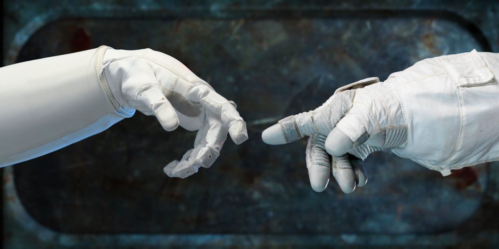 An artists rendering of an astronauts hand reaching out towards the hand of an alien. NASA.