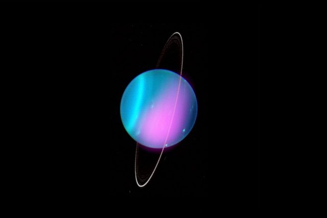 Composite image of Uranus from Chandra's observations in 2002. You can see the X-Ray emissions in pink. Credit: X-ray: NASA/CXO/University College London/W. Dunn et al; Optical: W.M. Keck Observatory
