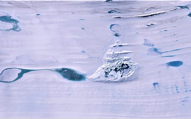 In the center is the fractured ice of the valley on the Аmery Ice Shelf where once used to be a massive lake. It is surrounded by other lakes with meltwater. Credit: NASA ICESat-2