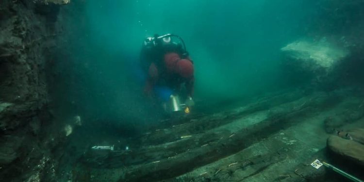 An underwater archaeologist exploring the shipwreck at the bottom of the sunken city. Image Credit:Ministry of Tourism and Archaeology.