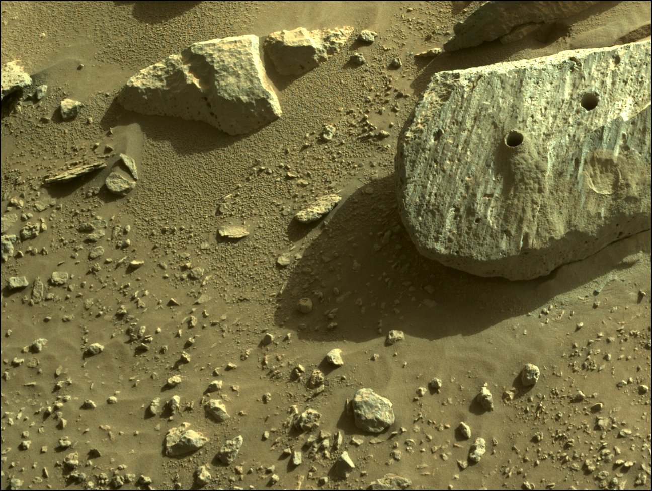 The Rochette boulder where the rover took the first two cores. Credit: NASA