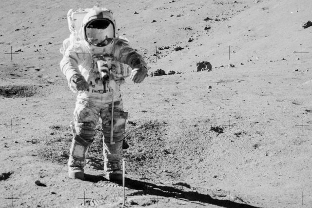 An astronaut from the Apollo 17 mission while collecting lunar samples in containers. Credit: ESA/NASA