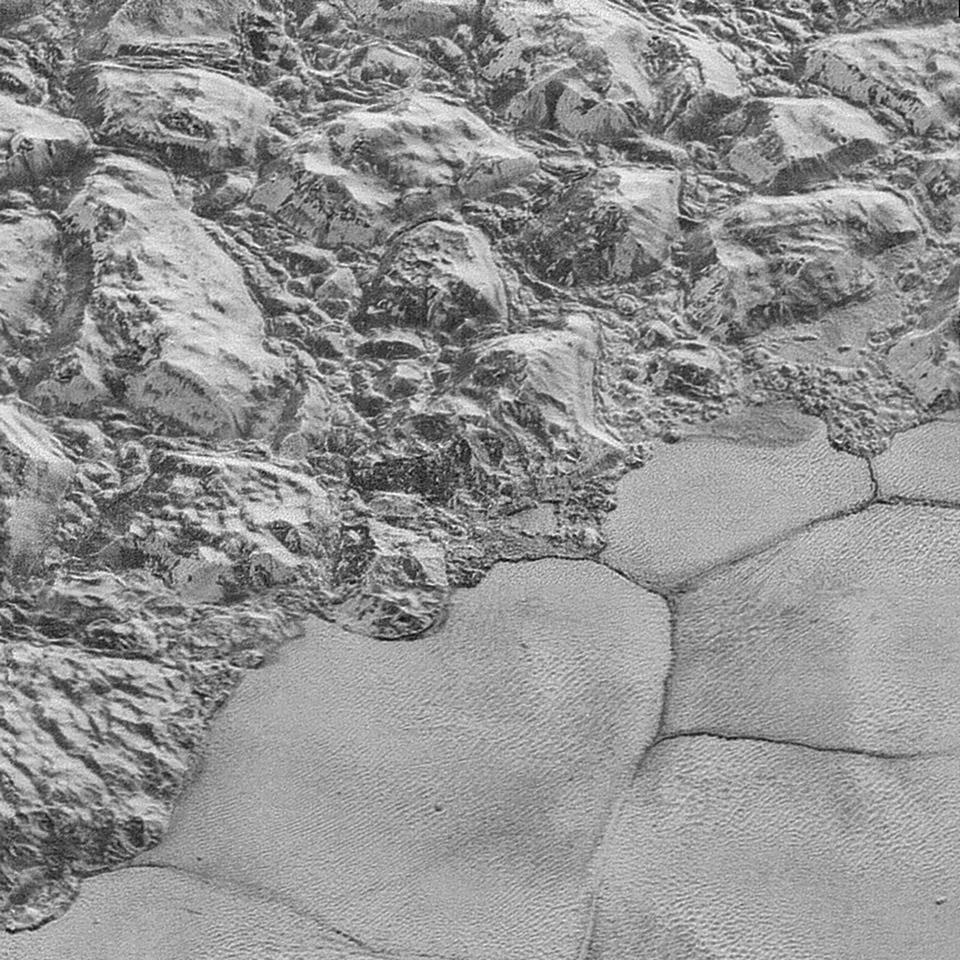 Mountains and Sputnik Planitia, the most famous region in Pluto's heart-shaped Tombaugh Regio. Credit: NASA / JHUAPL / SwRI