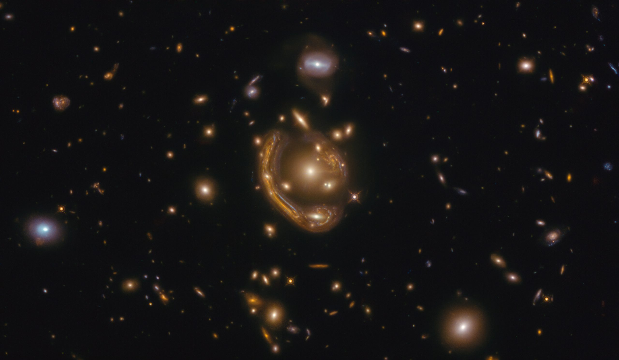 The month of February includes an image of an Einstein ring known as GAL-CLUS-022058s. Credit: ESA/Hubble & NASA, S. Jha